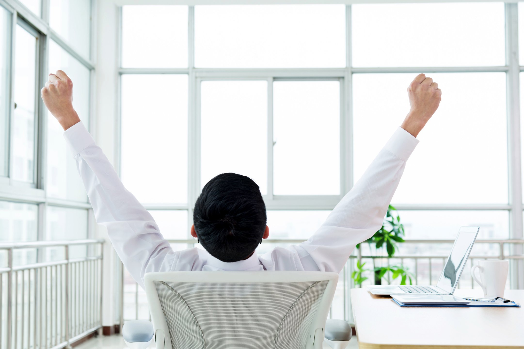 Businessman stretching at office